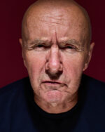Irvine Welsh, Scottish author, close-up portrait against deep red background. London. Photograph by David Levene, 13 July 2026